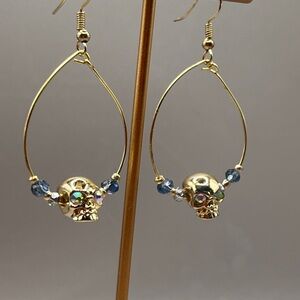 Gold Skull Earrings with Blue Accents